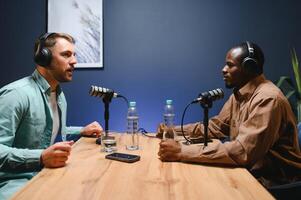 Podcast presenter having live discussion with man, streaming it for audience on internet entertainment show. Influencer enjoying chat with guest photo