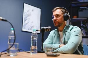 Podcast presenter having live discussion with man, streaming it for audience on internet entertainment show. Influencer enjoying chat with guest photo