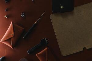 Crafting tools on natural cow leather in the tailoring workshop. Top view photo