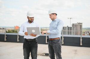 two architect engineers are walking in a constructed office building. implementation of the project photo