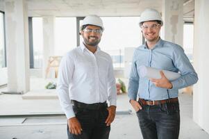 two architect engineers talking in a constructed office building photo