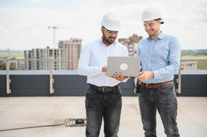 two architect engineers are walking in a constructed office building. implementation of the project photo
