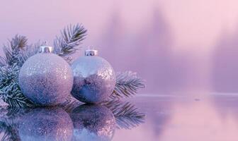 Two silver ornaments with glitter on them are sitting on a branch of a tree photo