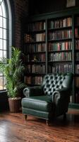 Cozy reading nook with green leather chair and bookshelves photo