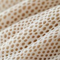Close-up view of porous material showcasing intricate patterns photo
