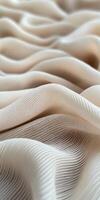 Soft beige fabric displaying elegant wavy texture photo