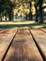 Sunlit wooden table in a peaceful park setting photo