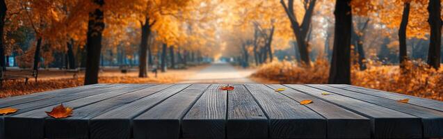 Relaxing autumn pathway with wooden table in the foreground photo