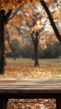 Autumn landscape with wooden table in a park setting photo
