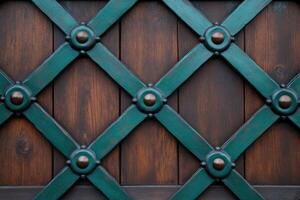 Decorative wooden door with intricate metal lattice design photo