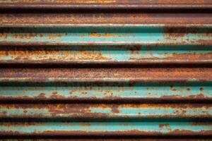 Textured rusty metal surface with blue and brown tones photo
