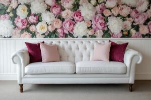 Elegant white sofa with pink floral wallpaper backdrop photo