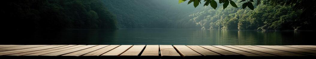 Serene lake view from wooden dock in early morning light photo