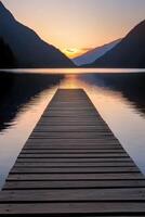 Sunset view from the wooden pier overlooking the lake photo