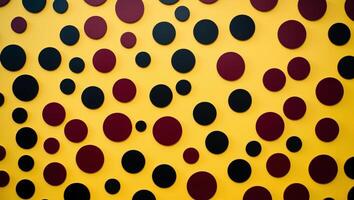 A yellow background with a lot of black and red circles. photo