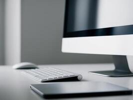 A computer workstation with a keyboard and a monitor. photo