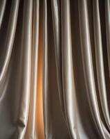 Soft and rich folds of silky drapes in low light create elegant atmosphere photo