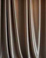 Soft and rich folds of silky drapes in low light create elegant atmosphere photo