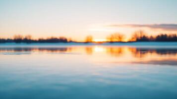 A serene sunset reflected on calm water, creating a tranquil atmosphere. photo