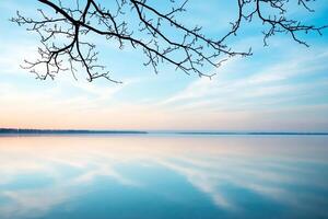Serene lakeside view with soft colors and a tranquil atmosphere. photo