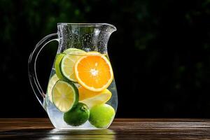 A pitcher of water infused with citrus fruits for refreshment. photo
