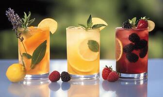 Three colorful beverages with fruits and herbs, ideal for refreshment. photo
