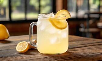 A refreshing glass of lemonade with ice and lemon slices. photo