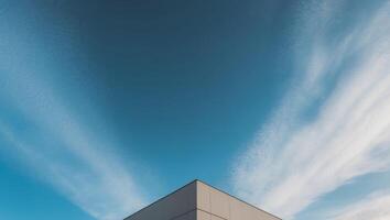 a building with a blue sky and a building with a sky background. photo