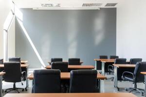 Empty classroom with table and chairs for lecture or seminar in university. photo