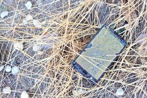 Broken damage mobile in sun light photo
