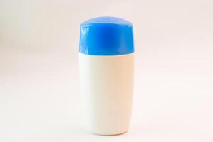 Cream bottle isolate in studio light photo