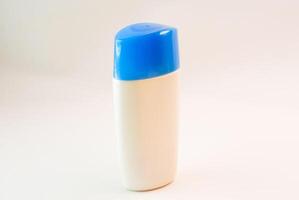 Cream bottle isolate in studio light photo