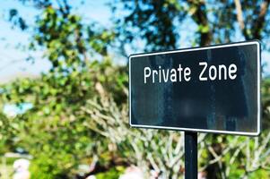 Private zone sign standing for restricted access photo