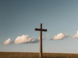 Sunlight shine on wooden cross on open field with blue sky white clouds in background. photo