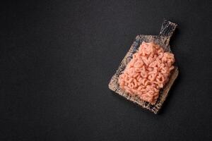 Raw minced chicken with salt, spices and herbs photo