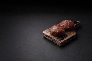 Beef burger patties with salt, spices and herbs photo