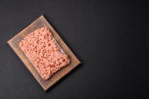 Raw minced chicken with salt, spices and herbs photo