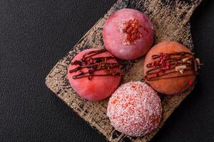 Delicious colorful asian mochi sweets with rice dough shell and fruit filling photo