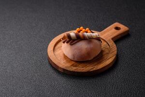 Delicious colorful asian mochi sweets with rice dough shell and fruit filling photo