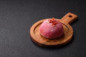 Delicious colorful asian mochi sweets with rice dough shell and fruit filling photo