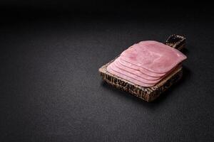 Boiled ham cut into square slices with sorrel and spices photo