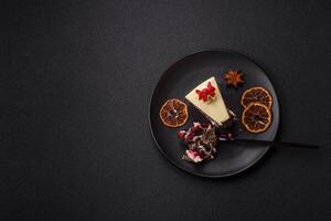Piece of sweet layered cheesecake with cherries and poppy seeds photo