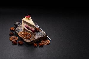 Piece of sweet layered cheesecake with cherries and poppy seeds photo