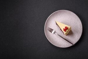 Piece of sweet layered cheesecake with cherries and poppy seeds photo