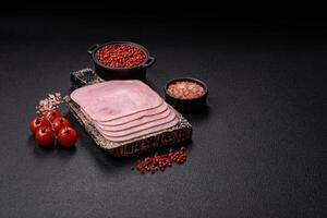 Boiled ham cut into square slices with sorrel and spices photo