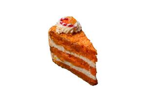 Piece of sweet layer cake with pumpkin or citrus flavor with cream photo