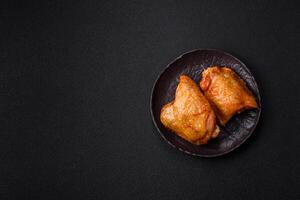 Chicken thighs fried with salt, spices and herbs photo