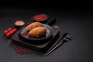 Delicious fresh cutlet or meatball Kiev style with filling photo