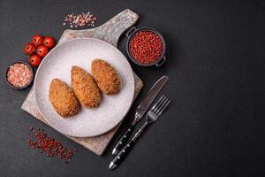 Delicious fresh cutlet or meatball Kiev style with filling photo