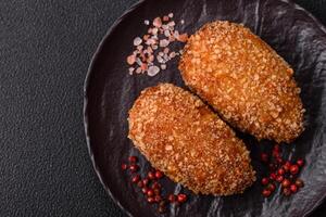 Delicious fresh cutlet or meatball Kiev style with filling photo